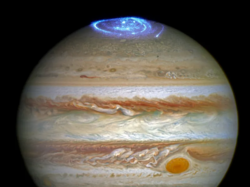 Jupiter with a bright blue glowing ring of light around its pole