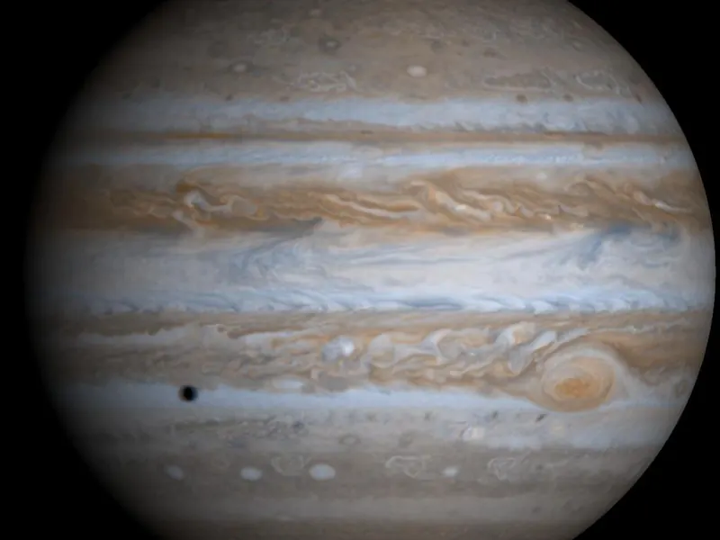Jupiter in soft colours, with stripes of cream and brown and the Great Red Spot