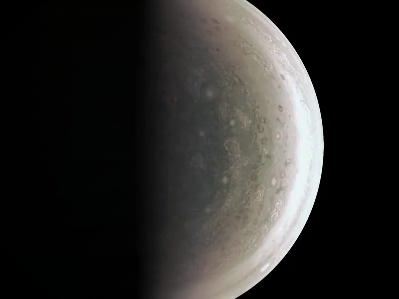 Jupiter’s south pole seen from below: a blue-grey swirl of oval storms